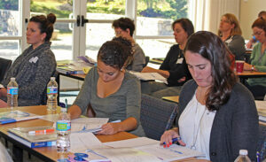 Just Words workshop participants taking notes