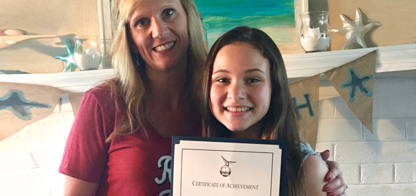 Ainsley celebrated with her tutor, Wilson Dyslexia Practitioner Christine Fagan, when she completed the Wilson Reading System in sixth grade.