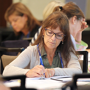 women taking notes