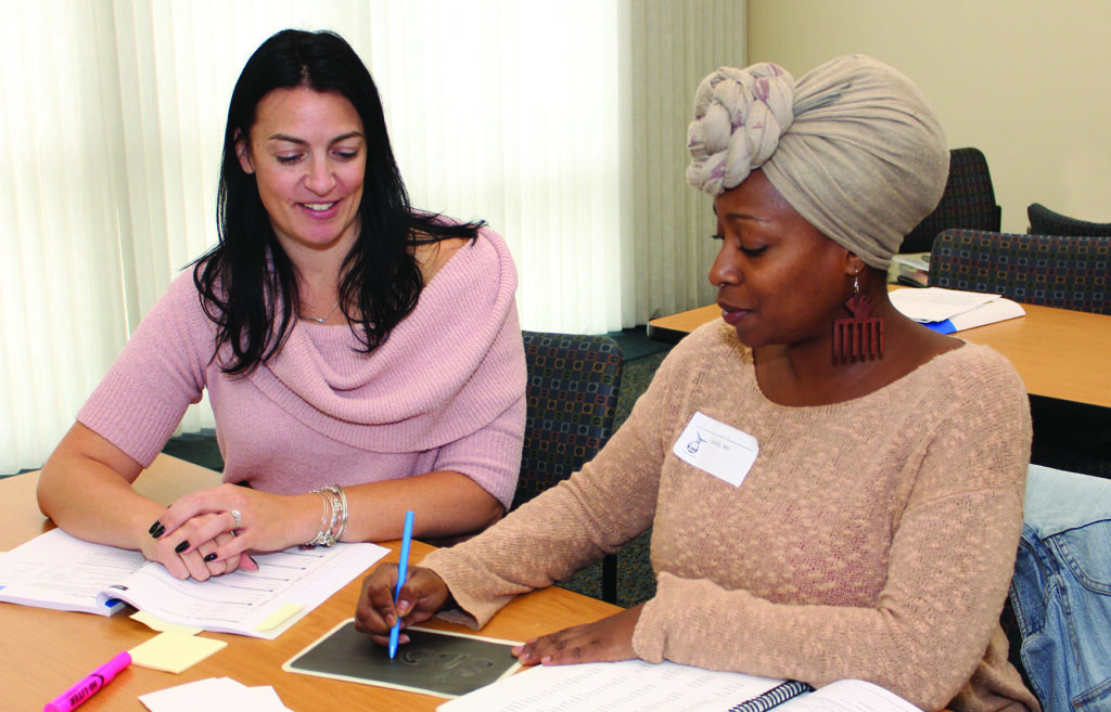 2 educators at a Wilson Workshop