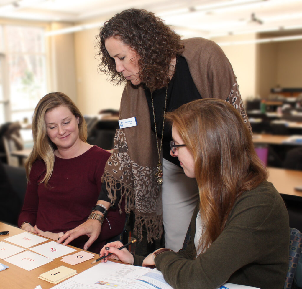 A Wilson Presenter discussing sound cards with workshop participants 