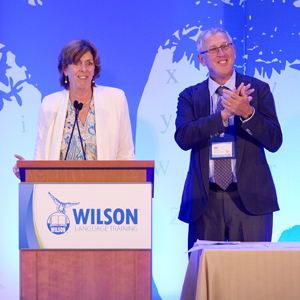 Barbara and Ed Wilson at the podium