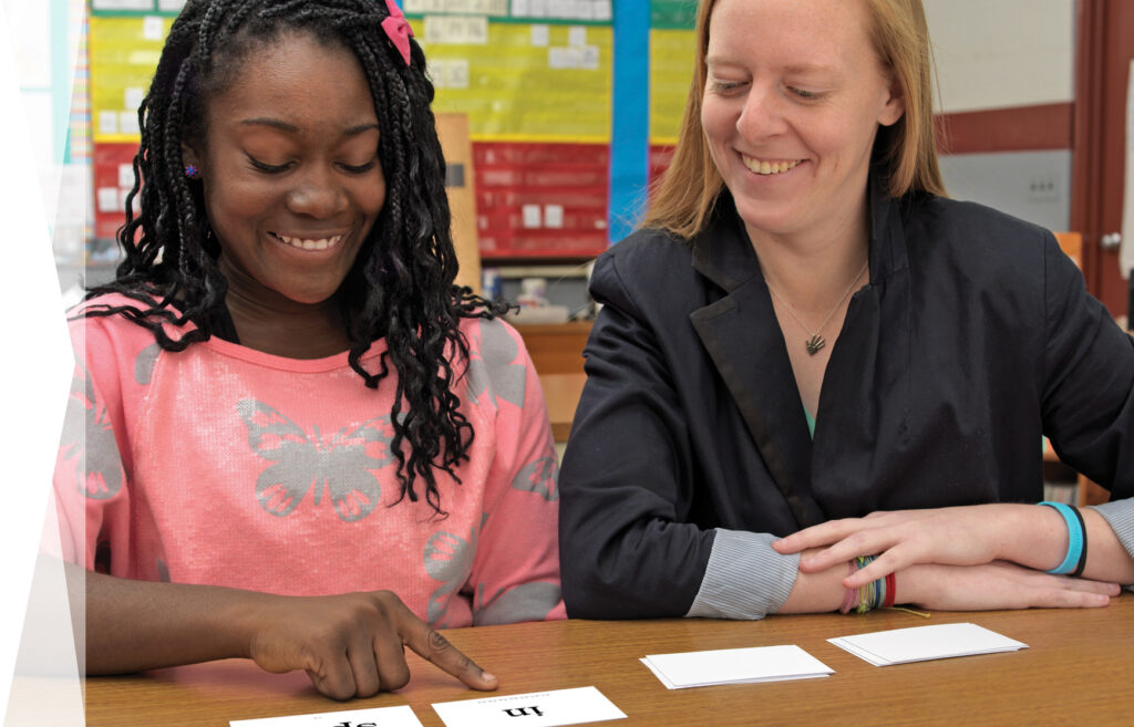 WRS Teacher with student and syllable cards