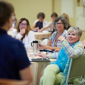 Conference participants enjoying a presentation