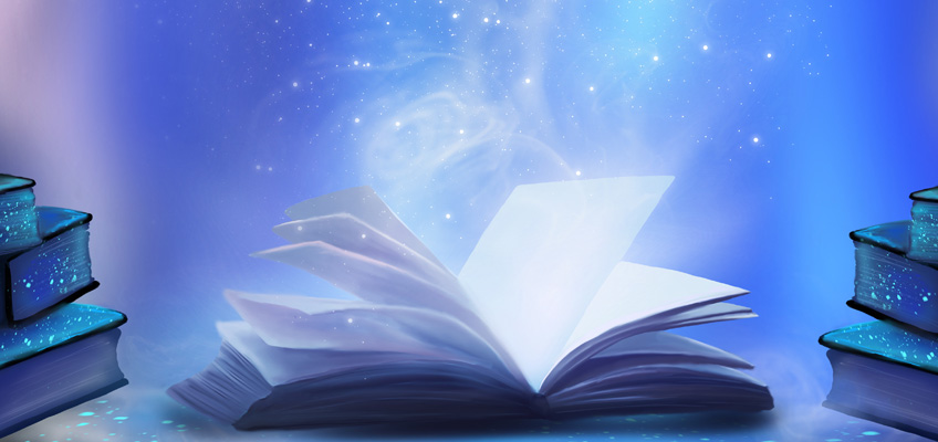 An open book with a starry haze coming out of the pages like magic