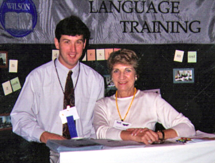 WLT Co-founder Ed Wilson standing next to Maxine Goldman