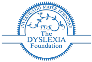 Blue circular logo of The Dyslexia Foundation with Latin text "INVESTIGATIO MATER SCIENTIAE" around the edge. Innen, a vine-like design with "TDF" and the words "The Dyslexia Foundation" in the center.