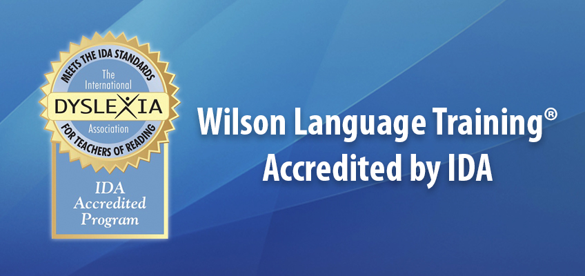 Seal of accreditation from the International Dyslexia Association with the text Meets the IDA Standards for Teachers of Reading and IDA Accredited Program. Next to it, text reads Wilson Language Training Accredited by IDA on a blue background.