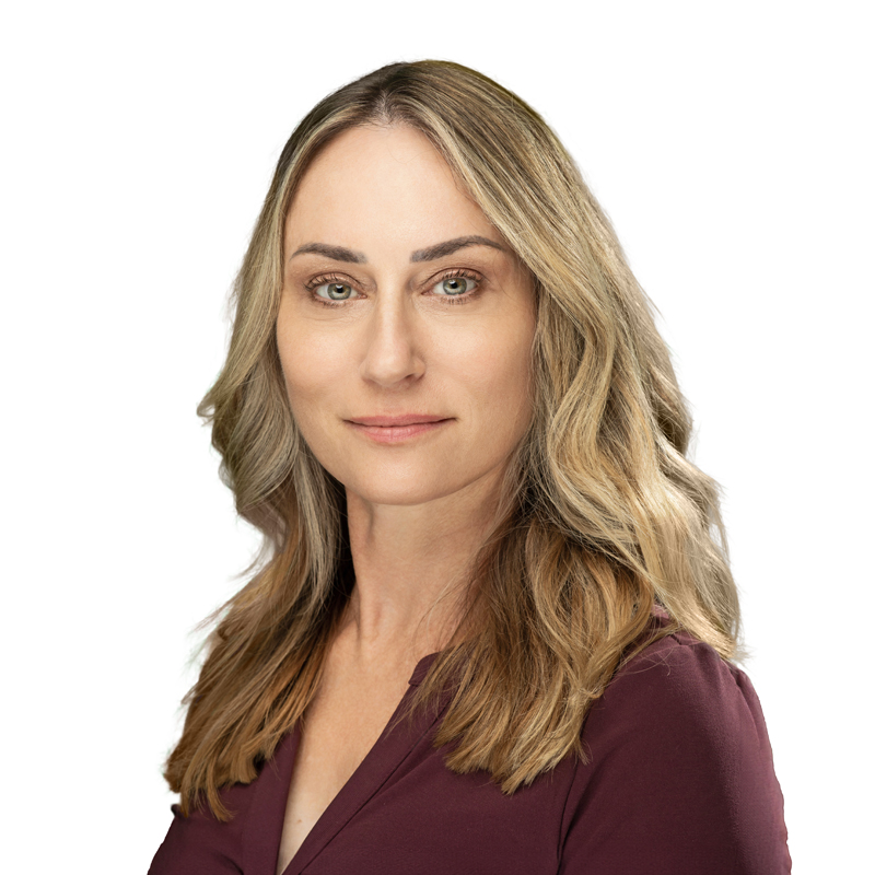 Jennifer D’Aoust wearing a burgundy blouse and smiling at viewer.