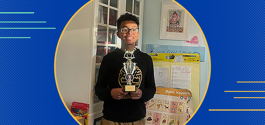 Boy holding an award