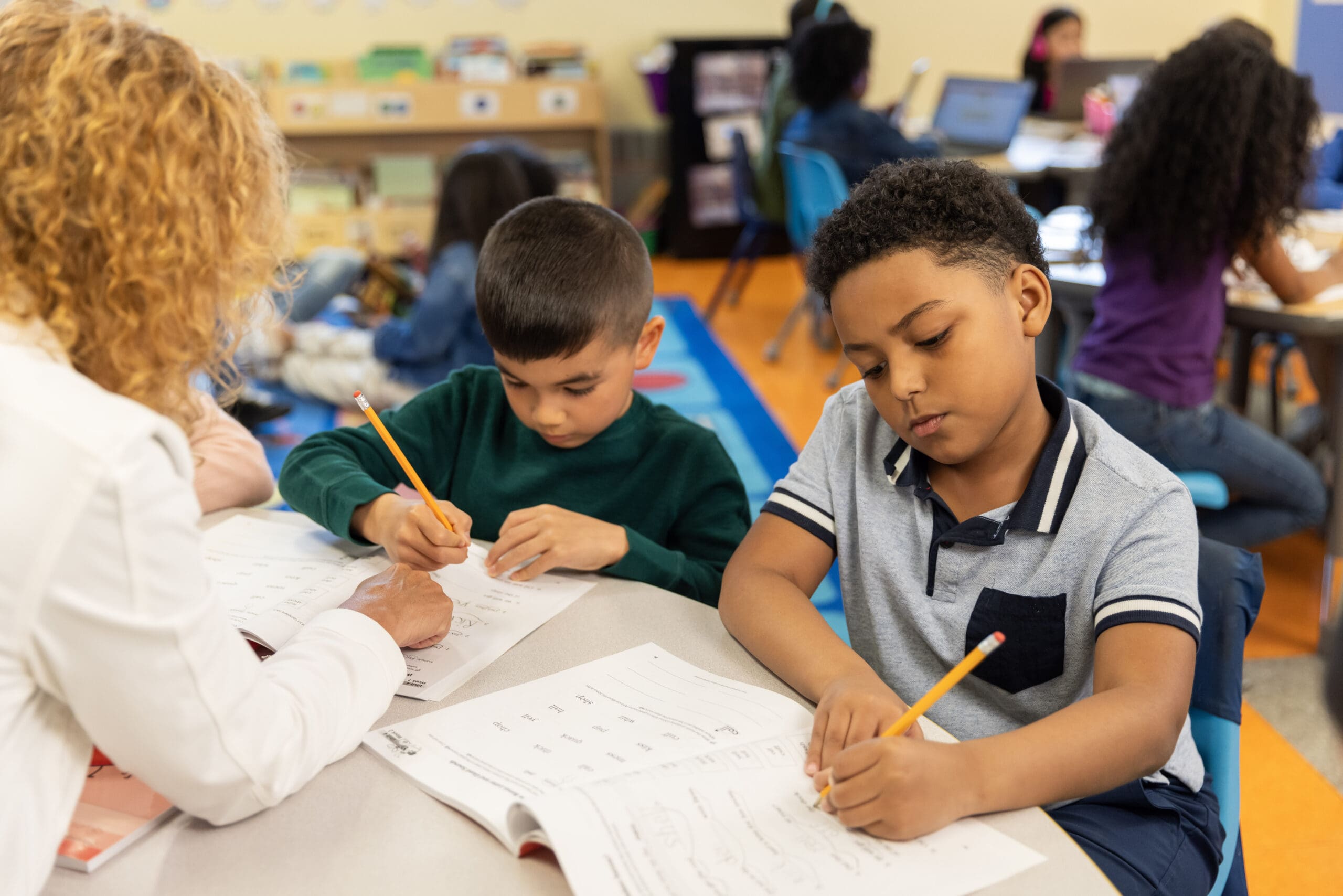 Fundations K-3 students working with teacher on writing exercises