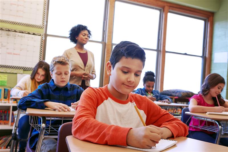 Fundations 4-5: Diverse students and teacher in a classroom setting.