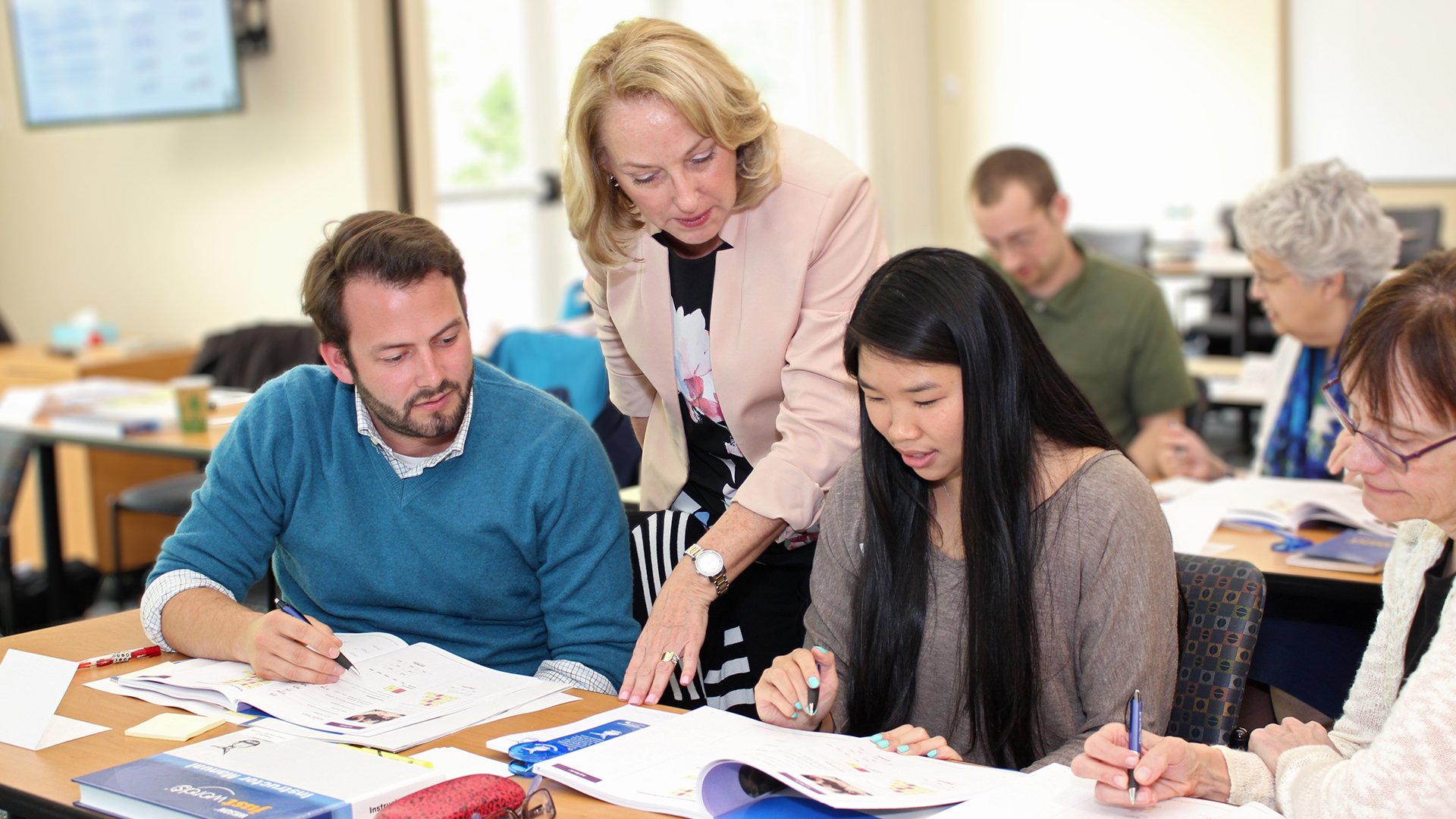 Wilson Language Training instructor guides students in a classroom.